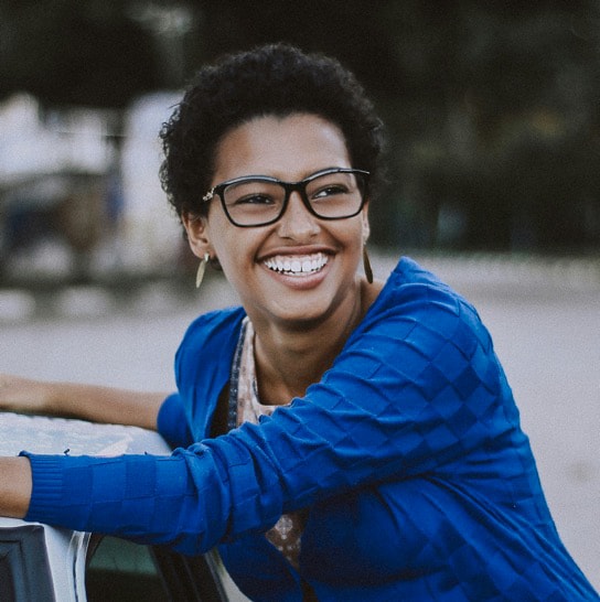 Smiling lady in glasses.