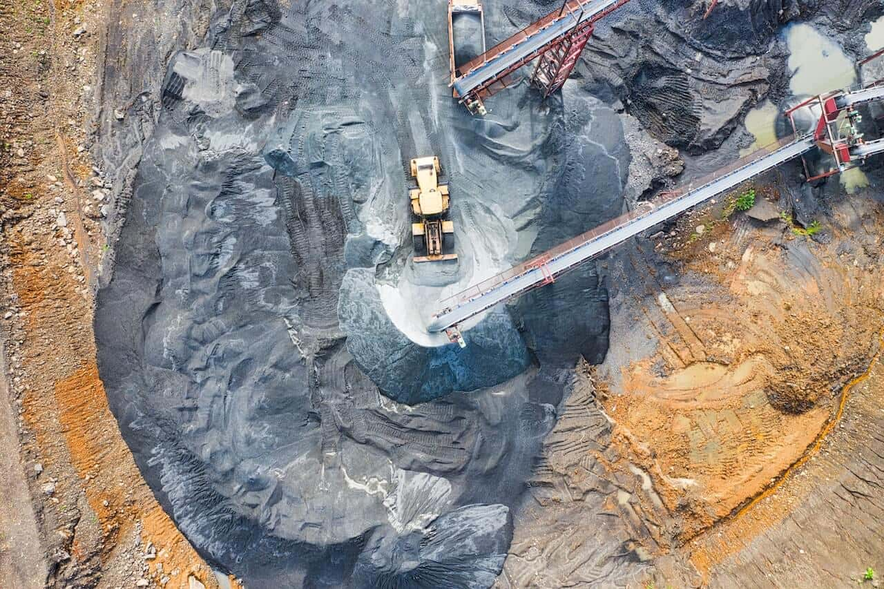 An aerial view of a mining site, showing the layout of the excavation area and surrounding terrain.