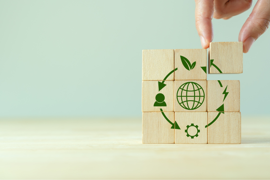 Circular economy concept, recycle, environment, reuse, manufacturing, waste, consumer, resources. LCA Life cycle assessment. Sustainability Wooden cubes; symbol of circular economy on grey background.