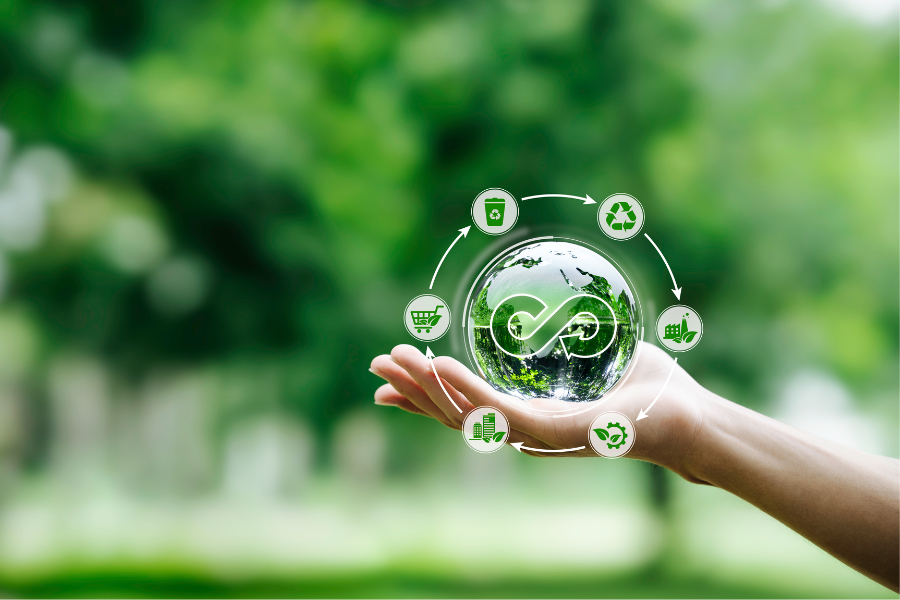 Hand-holding crystal globe with icon on circular economy.