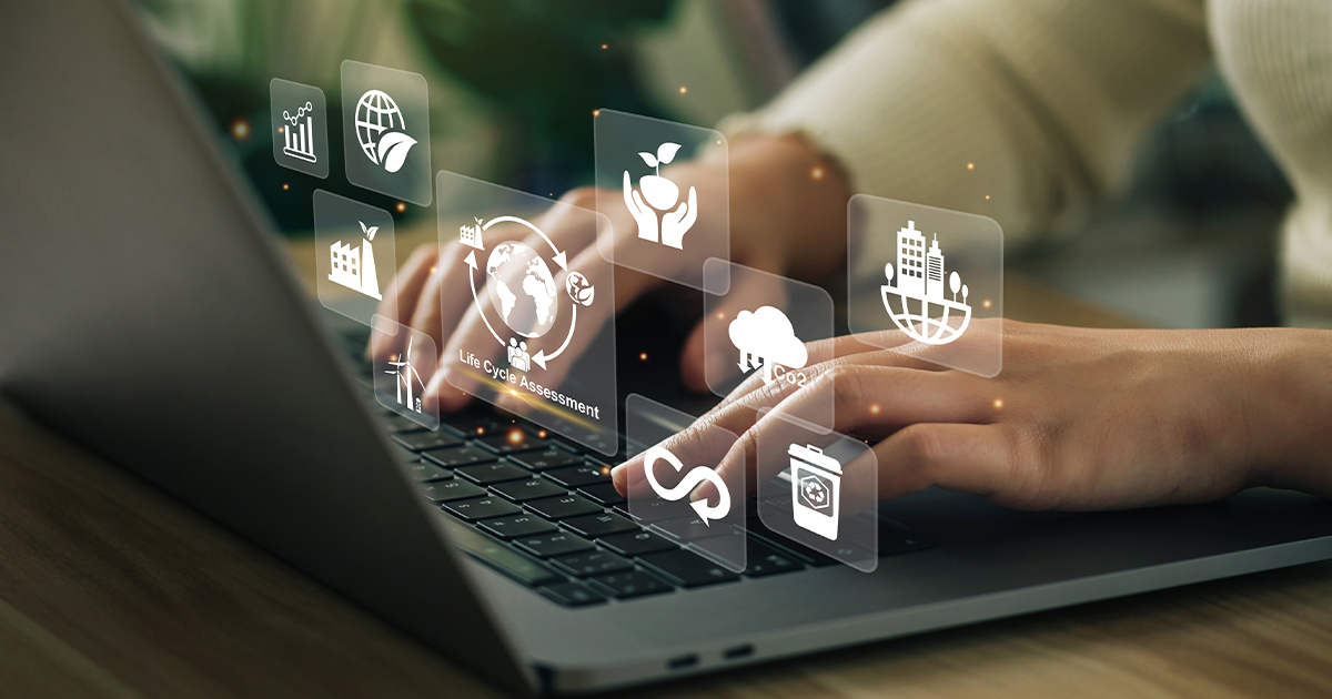 Person typing on a laptop with a Life Cycle Assessment (LCA) icon displayed on the screen.