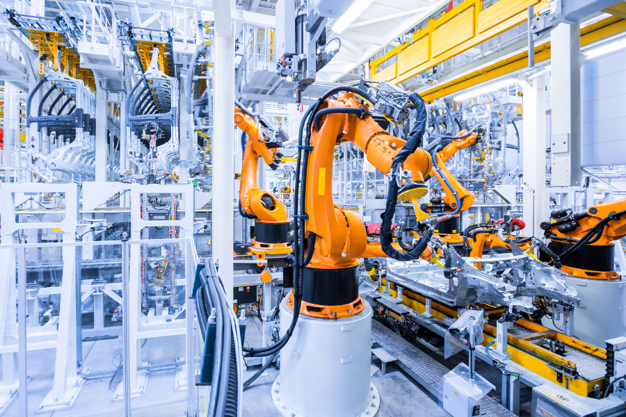 robots working in an assembly line in a factory