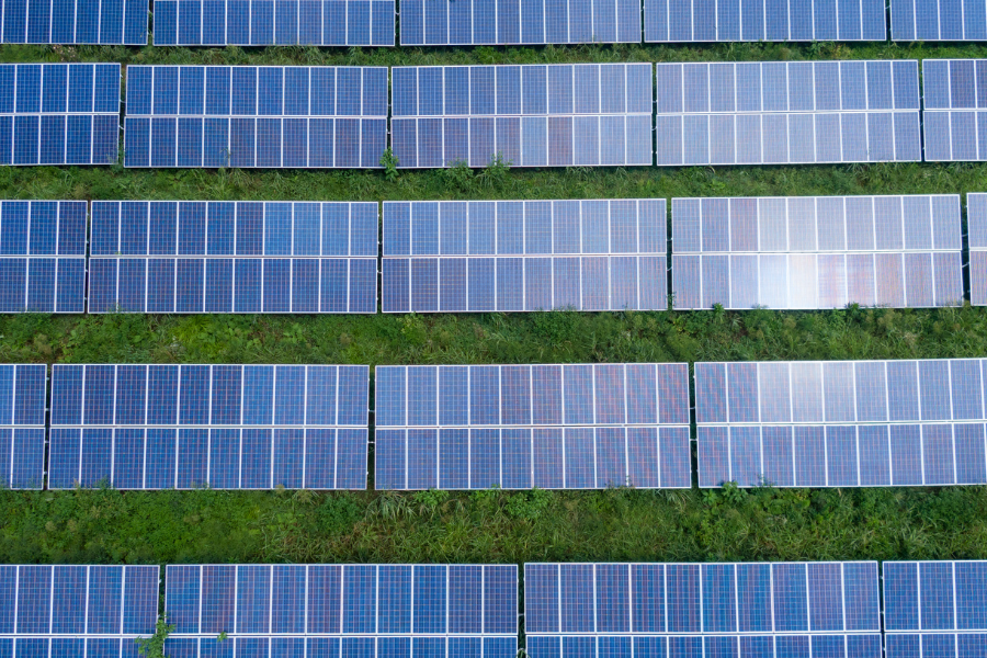 an aerial view of rows of solar panels