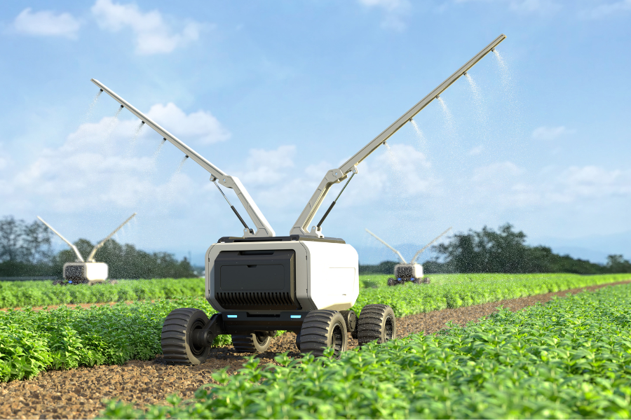 A tractor with a sprayer in the middle of a field