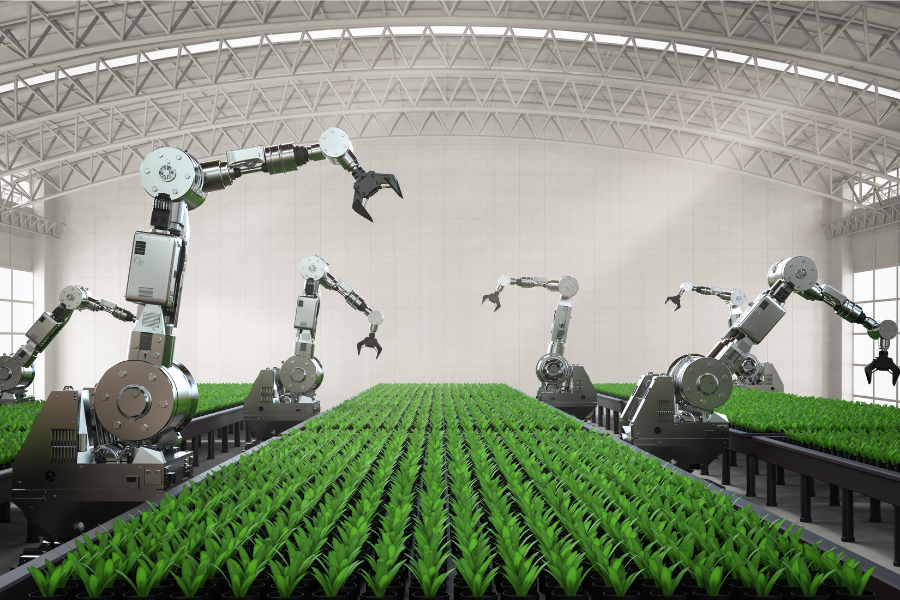 robots in a factory with grass growing on the floor