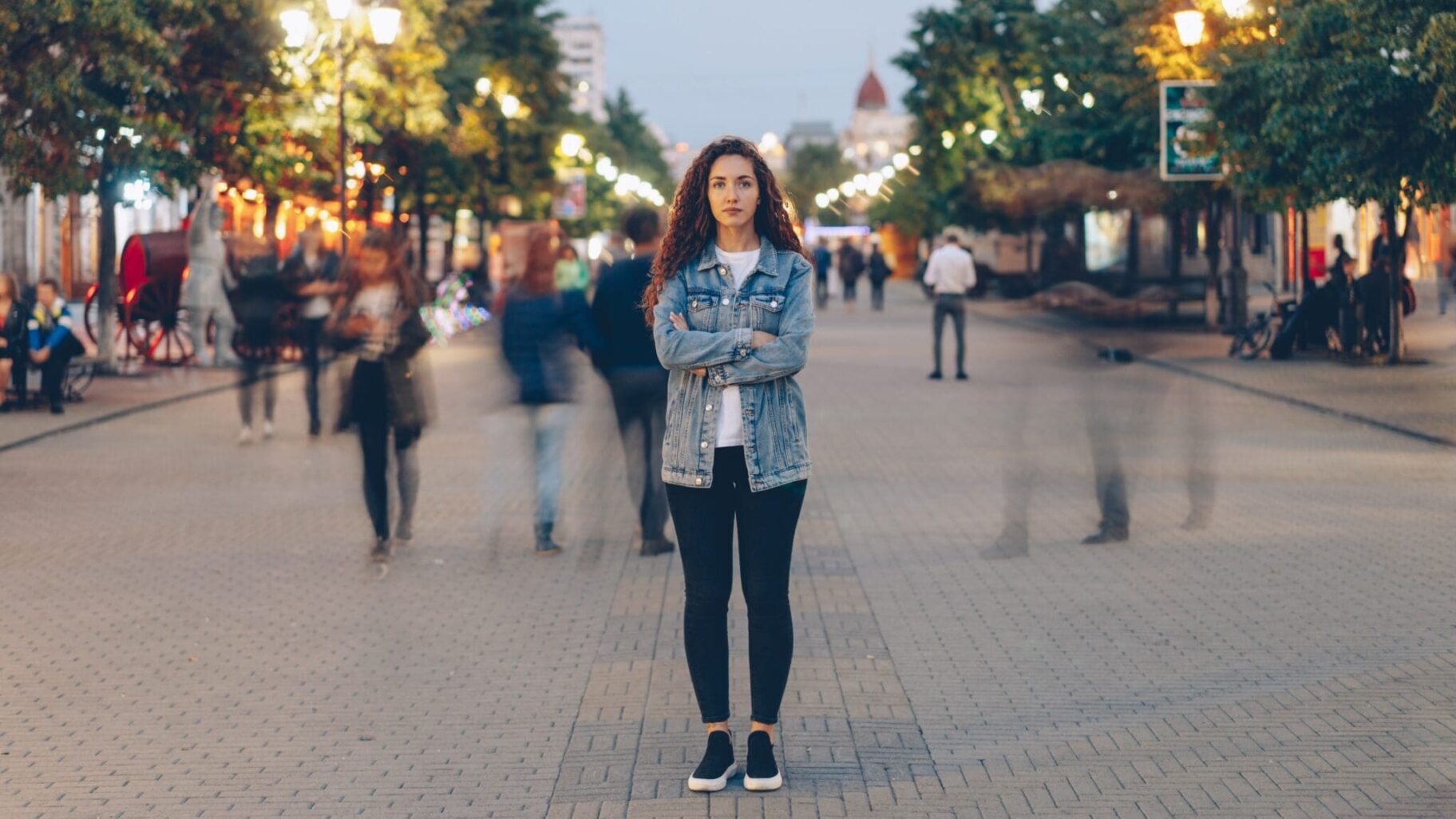 a person standing in the middle of a city street